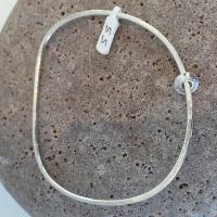 Pebble Bangle with float charms by Ann Bruford